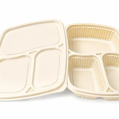 Beige plastic compartmentalized lunch tray with multiple curved sections for different foods.