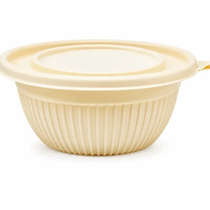 Collapsible beige silicone mixing bowl with a matching lid and small tab handle on the rim