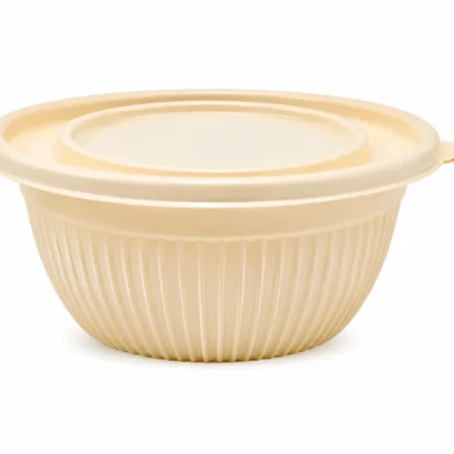 Beige collapsible silicone mixing bowl with a lid and small side handle
