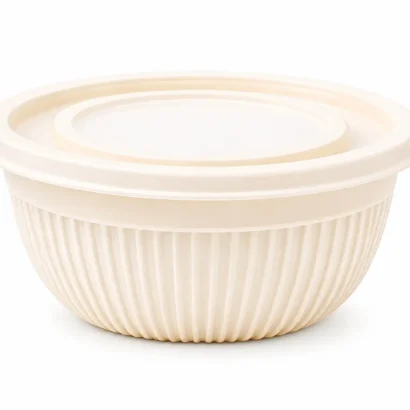 Cream-colored collapsible mixing bowl with a lid and side handle on a white background.